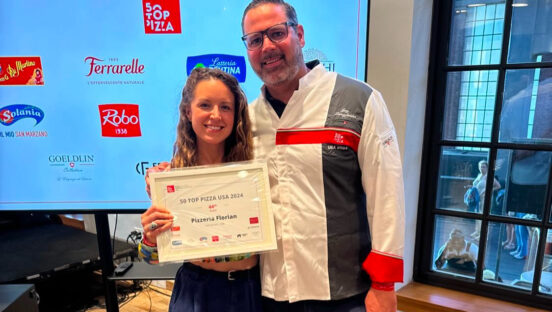 This photo shows Amanda Jones and Jay Langfelder accepting a certificate from 50 Top Pizza.