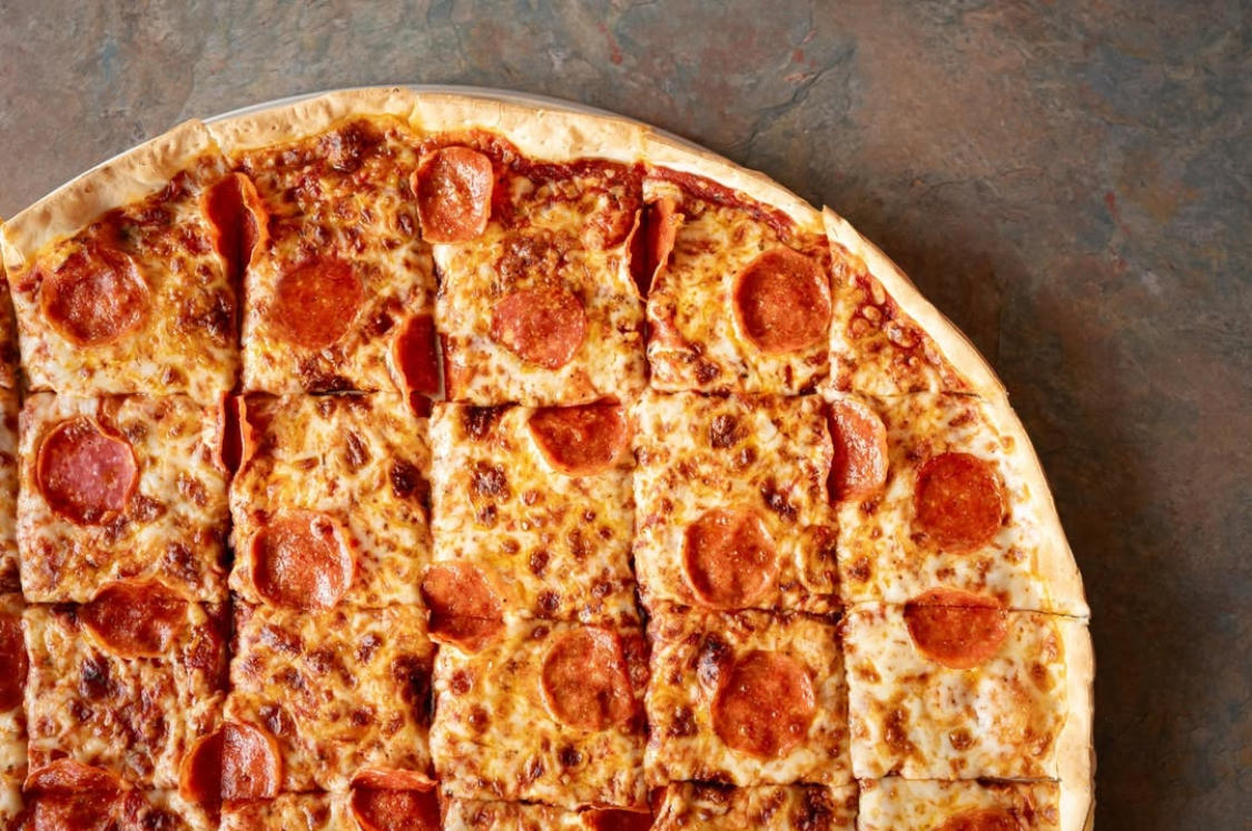 This photo shows a round pepperoni and cheese pizza from Mazzio's.