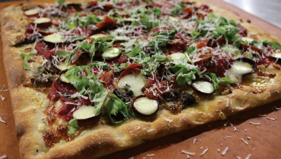 This photo shows the Rosemary Sicilian Grandma Pizza described in the recipe.