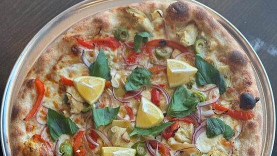 This photo shows the Screaming Weasel pizza described in the article's text.