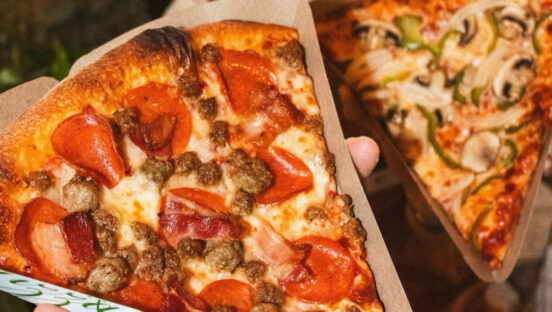 This photo shows a close-up of two slices of the specialty pizzas from Pizza Nova.