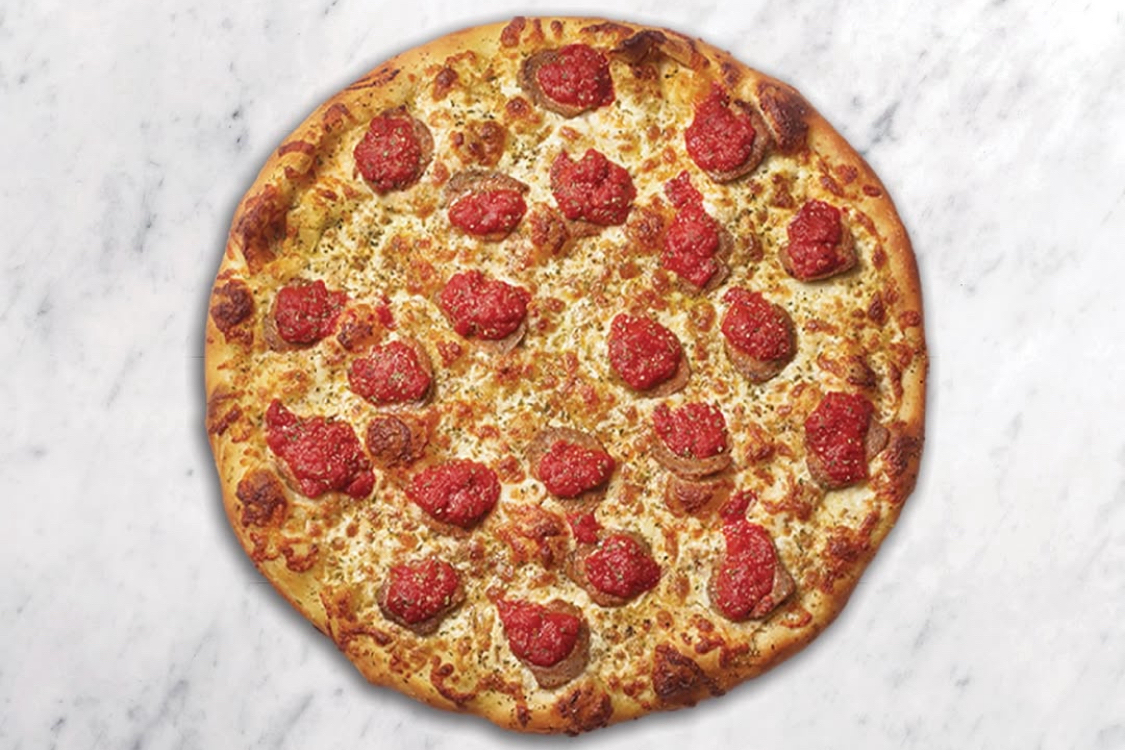 This photo shows a whole pizza topped with meatballs from Pizza Nova.