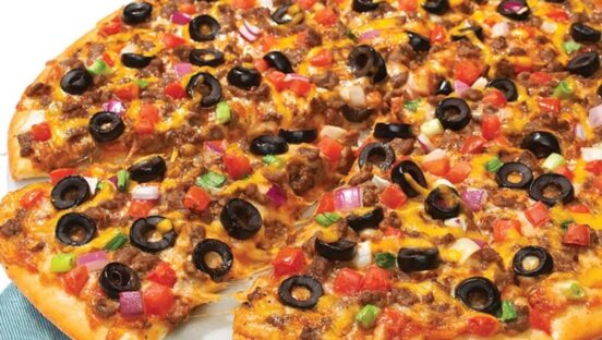 This photo shows the Taco Grande pizza with beef, tomatoes, black olives, cheese, black beans and salsa.