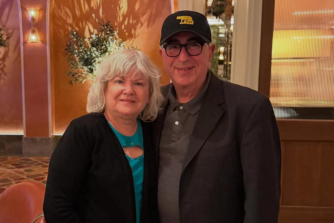 This photo shows Paulie and Mary Ann Giannone standing closely together and looking like a happy couple.