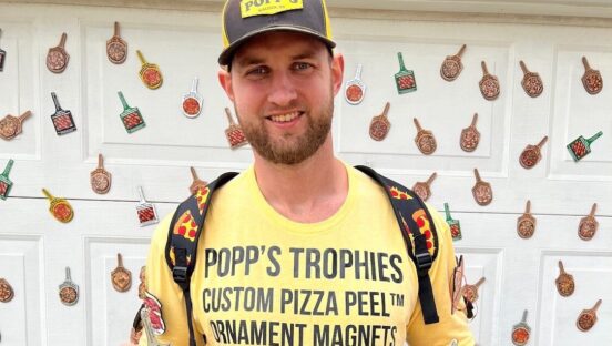 This photo shows Todd DeGroat wearing a yellow t-shirt advertising his business.