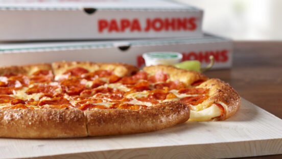 This photo shows Papa Johns' Epic Stuffed Crust Pizza with cheese oozing from the crust.