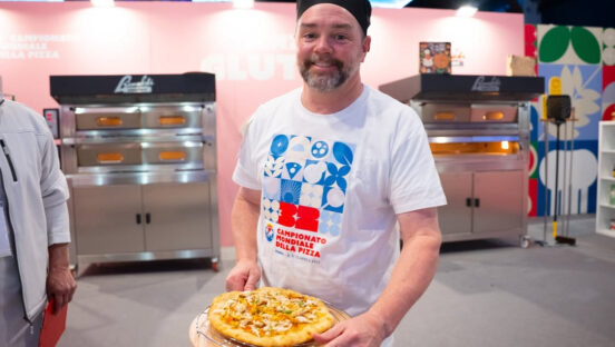 This photo shows U.S. Pizza Team member Dave Sommers with one of his competition pizzas.