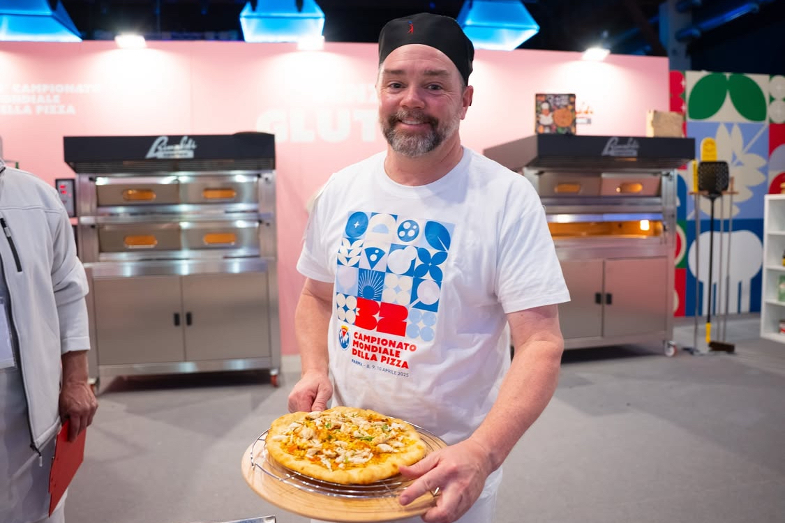 This photo shows U.S. Pizza Team member Dave Sommers with one of his competition pizzas.