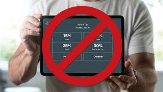 This photo shows a man in a white T-shirt holding a tip screen in front of him, but there's a big red circle with a diagonal line running through it to suggest "no tips required."