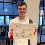 This photo shows Joe Powers holding up his 50 Top Pizza certificate at last year's worldwide ceremony.