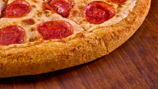 This photo shows the new Sweet Heat pizza with a bacon-flavored crust from Hungry Howie's that's described in the article.