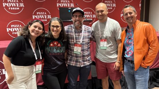 This is a group shot showing Matt Plapp, wearing his trademark orange jacket, with four other Pizza Power Forum speakers, lined up in front of a branded dark-red PPF backdrop.