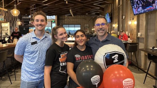 This photo shows Spinato's CEO Anthony Spinato holding balloons with two female and one male employees in the brand's Tempe location.