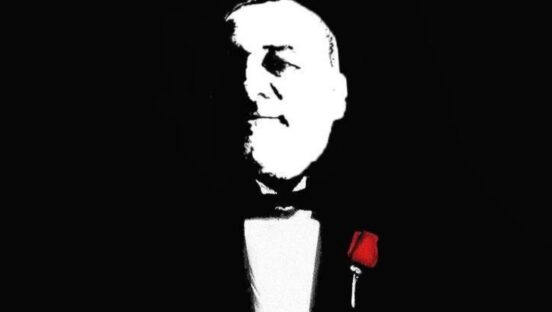 This photo shows a Godfather-style silhouette of Max D'Amico.