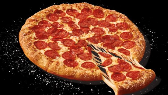 This photo shows the stuffed-crust pizza described in the story, with a little cheese oozing out an extracted slice.