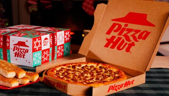 This photo shows a pepperoni pizza in a Pizza Hut box next to the newly repackaged Triple Treat Box.