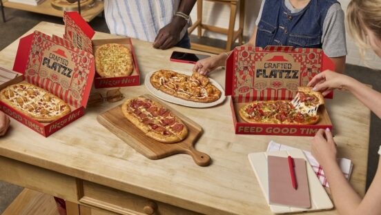 This photo shows customers digging into several varieties of Pizza Hut's Crafted Flatzz flatbreads in their own home.