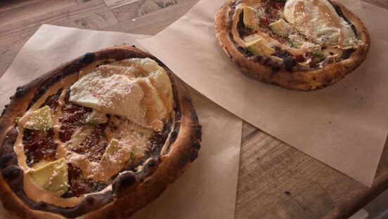 This photo shows two pizzaleadas, the Honduran/pizza sandwich described in the article.