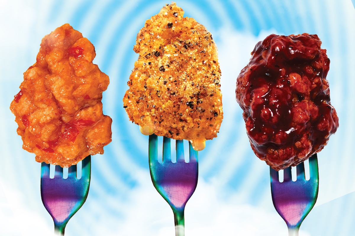 This photo shows three different types of boneless wings with different sauces, impaled with forks, against a blue spiral-like design in the background.