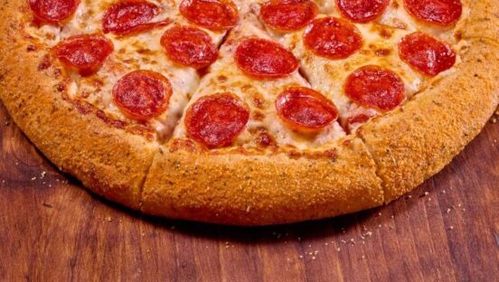 This photo shows one half of a pepperoni pizza from Hungry Howie's.