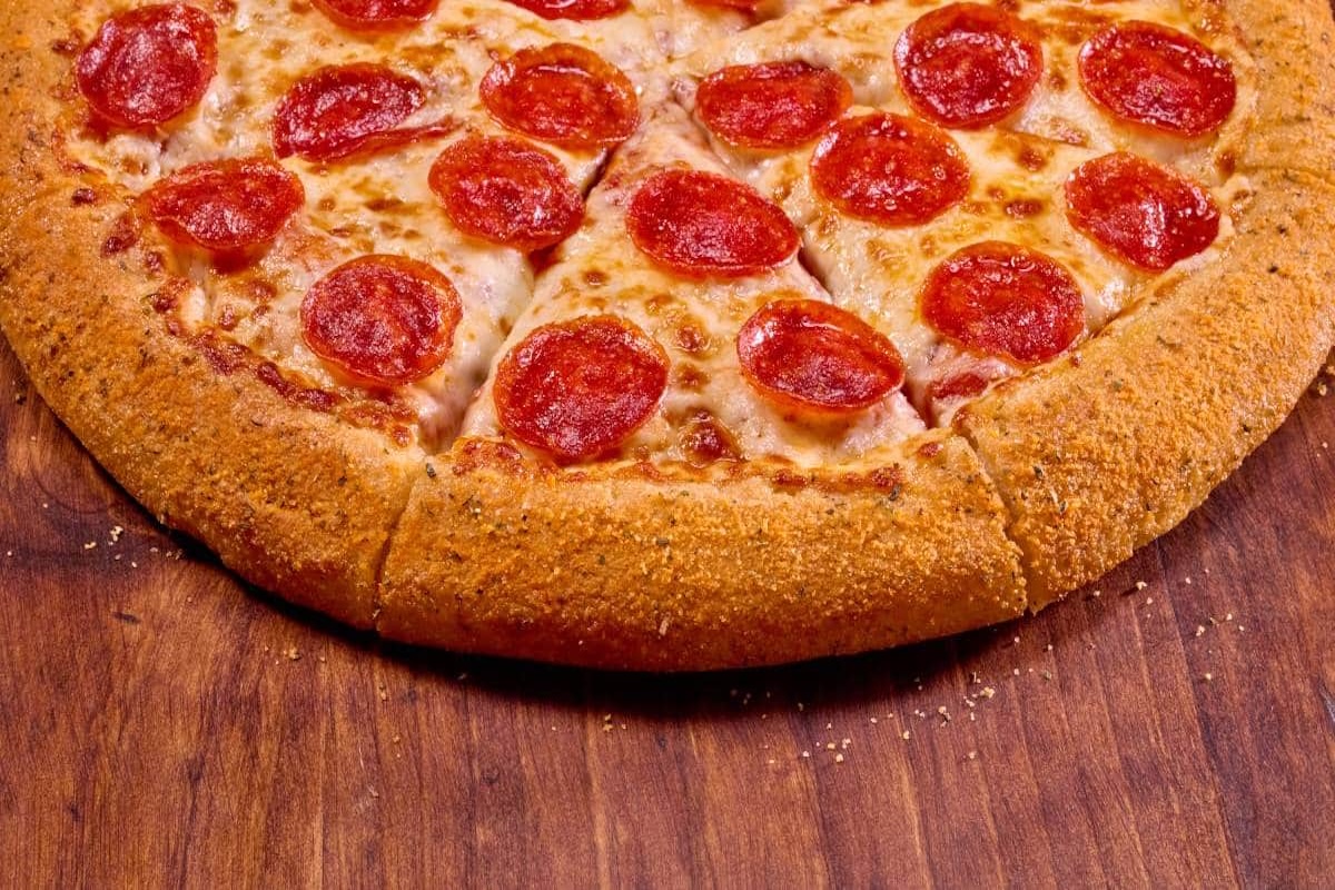 This photo shows one half of a pepperoni pizza from Hungry Howie's.