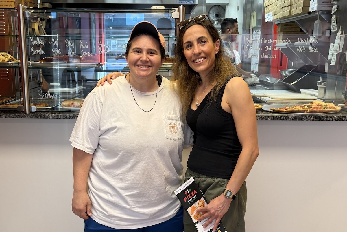 This photo shows Christy and Tori Tiso posing and smiling together.