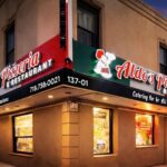 This photo shows the exterior of Aldo's Pizzeria and Restaurant as seen at night.