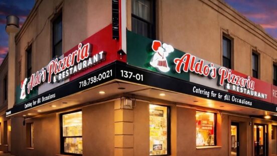 This photo shows the exterior of Aldo's Pizzeria and Restaurant as seen at night.