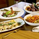 This photo shows several of the menu items listed in the story, including a lasagna dish, the pan-roasted chicken, the salmon and the filet skewers.