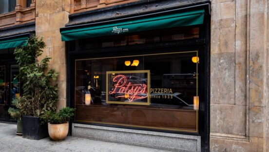 This photo shows the exterior of Patsy's Pizzeria at Freehand New York.