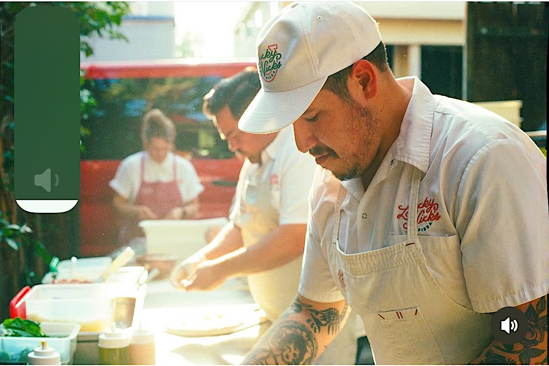 This photo shows Nick Camacho making his pizzas at an outdoors event catered by Lucky Nick's Pizza.