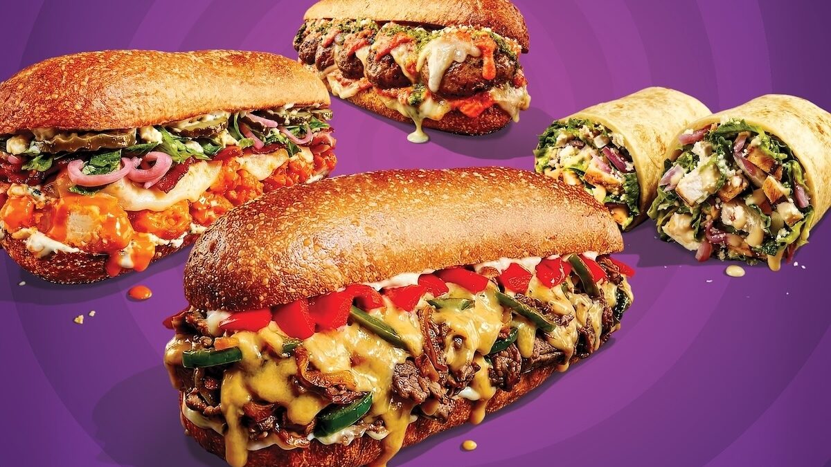 This photo shows various menu items that are described in the article itself, including the Beer Cheese Philly, the Meatball Parmesan and the Pesto Chicken sandwiches in the foreground, and two wraps in the background.