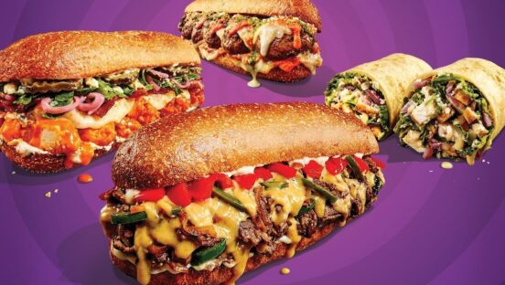 This photo shows various menu items that are described in the article itself, including the Beer Cheese Philly, the Meatball Parmesan and the Pesto Chicken sandwiches in the foreground, and two wraps in the background.