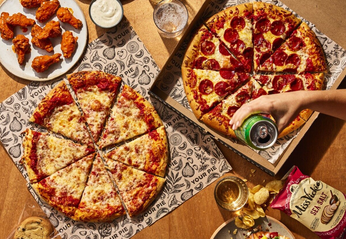 Customers share pizzas and other menu items at Your Pie.