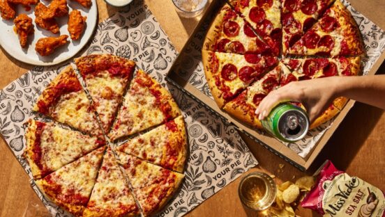 Customers share pizzas and other menu items at Your Pie.