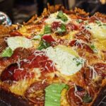 This photo shows a beautiful pizza from BFLO, one of the pizzerias in the top 10 list.