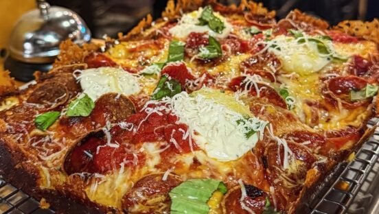 This photo shows a beautiful pizza from BFLO, one of the pizzerias in the top 10 list.
