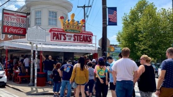 This photo shows a line of customers outside Pat's King of Steaks in Philadelphia.