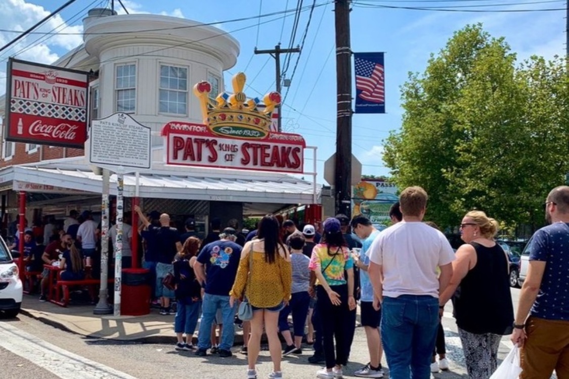 This photo shows a line of customers outside Pat's King of Steaks in Philadelphia.