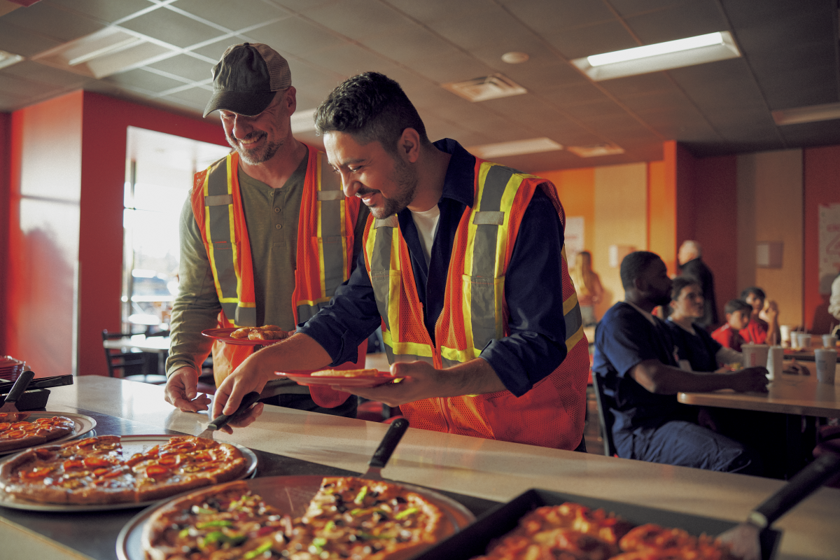 Customers eat at Cicis Pizza's buffet.