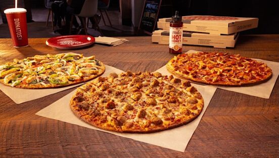 This photo shows the three pizzas described in the article.
