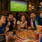 This AI-generated photo shows a group of male and female customers eating pizza in a restaurant while watching a soccer game on TV and cheering.