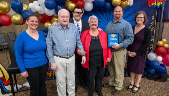 This photo shows Tom Sacco with the winners of Happy Joe's "Servant Hearts" awards.