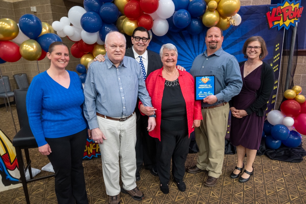 This photo shows Tom Sacco with the winners of Happy Joe's "Servant Hearts" awards.