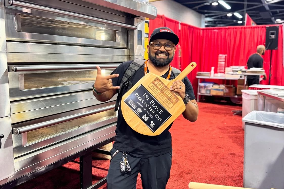 This photo shows Juan Robles holding one of his trophy peels after winning the California Pizza Challenge last year.