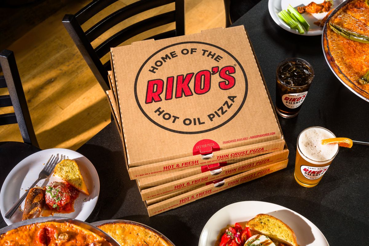 Riko's Pizza Hot Oil Pizza boxes with drinks and appetizers