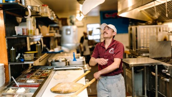 Gerardo Moceri Jr. tosses a dough for pizza at Gerardo's Pizzeria in Sedona, Arizona