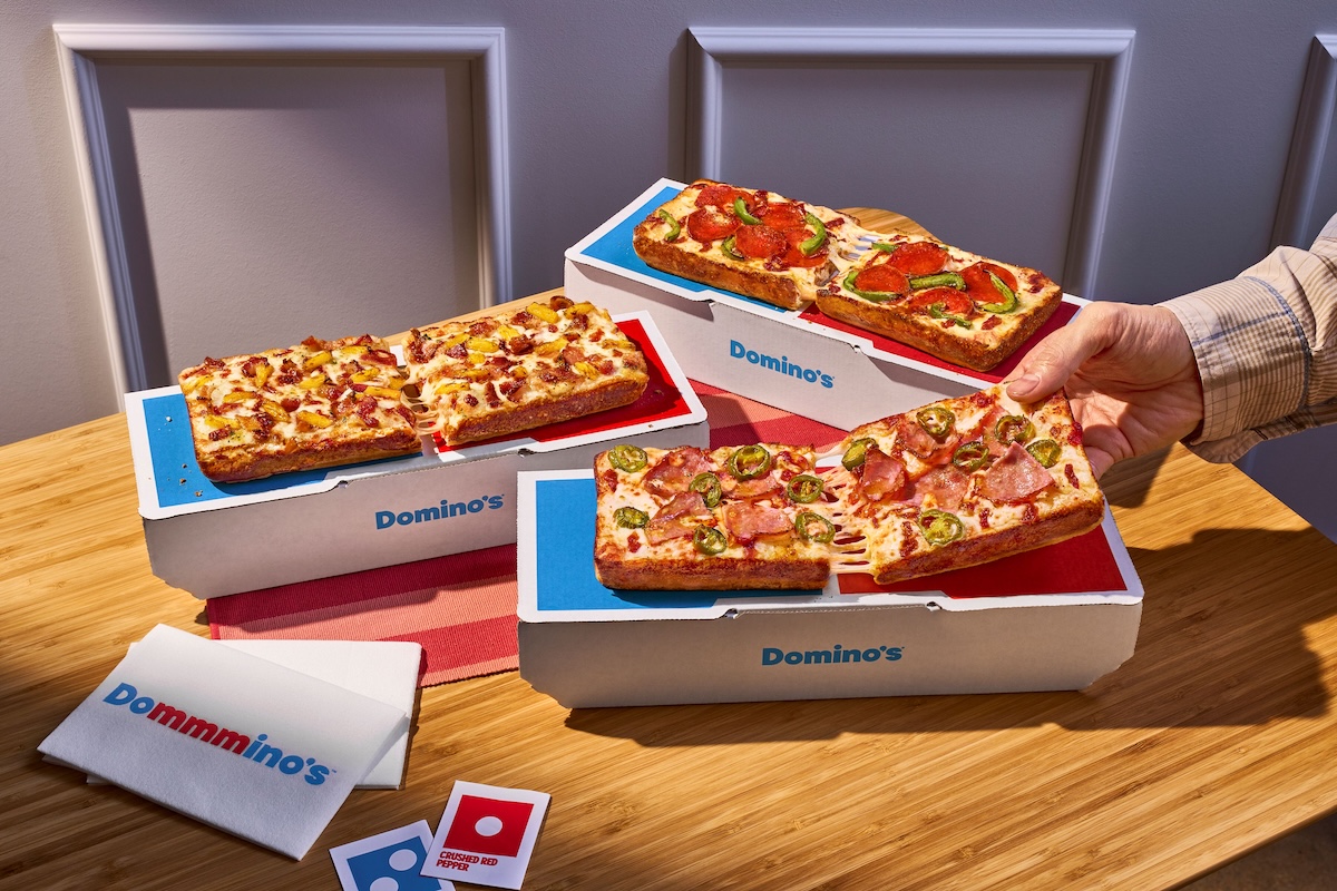 This photo shows several different variations of the Domino single-serve pizza.