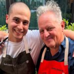 This photo shows pizzeria owner Luis Perez with his arms around the legendary Chris Bianco, both smiling for the camera.
