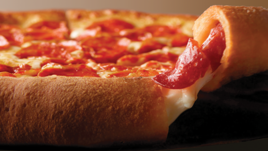 This photo shows a bit of cheese oozing out of the crust of Papa Johns Epic Pepperoni Stuffed Crust pizza.